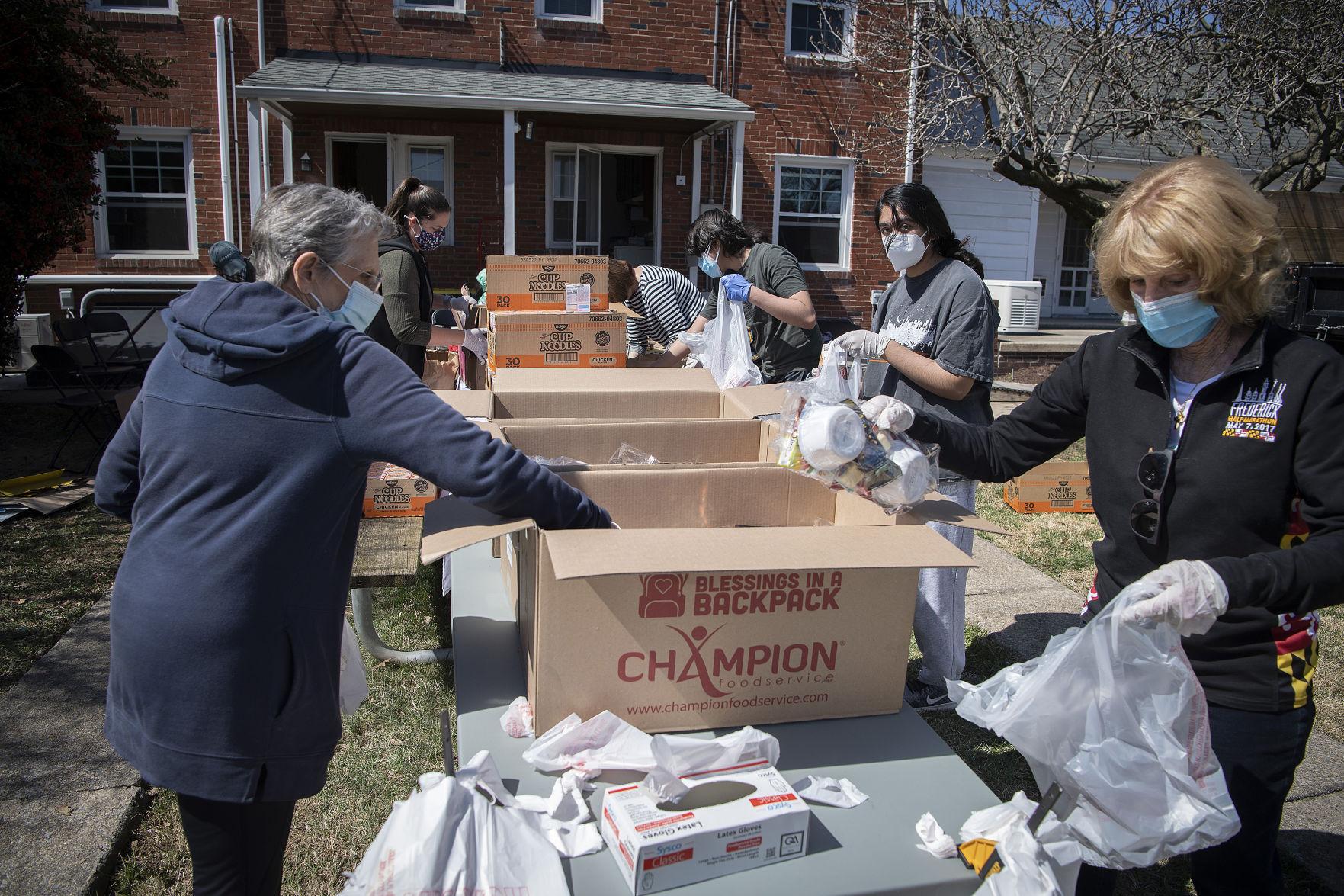 Blessings in a Backpack pop-up outdoor events help feed hungry kids, reunite volunteers